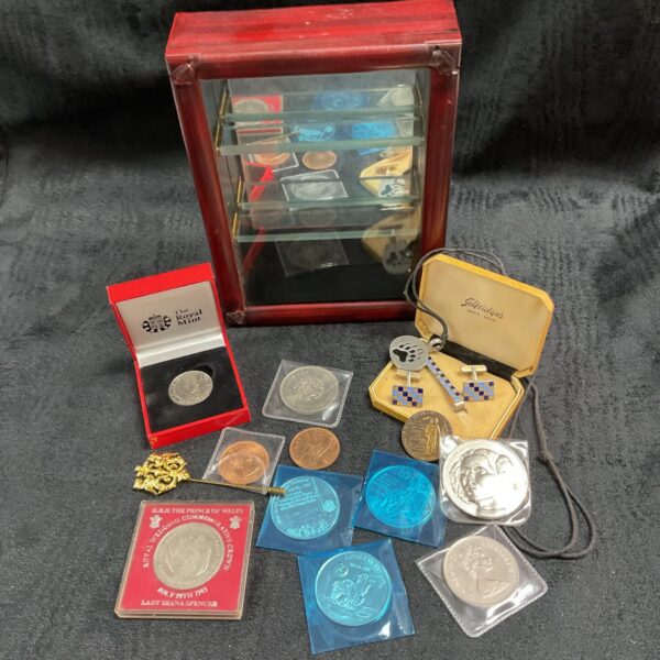 Display cabinet showcasing a coin collection with commemorative coins.