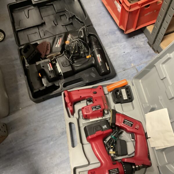 Two cordless multi-tool sets in carrying cases, untested power tools.