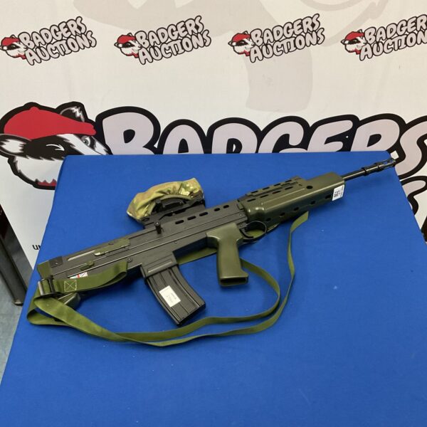 Grey plastic cosplay rifle with detachable strap.
