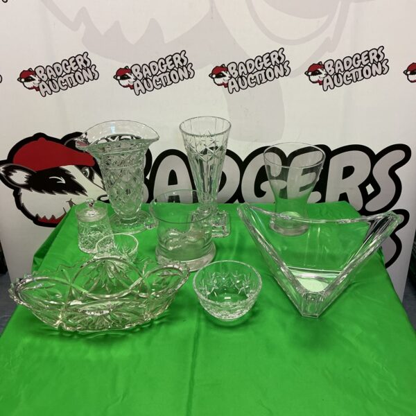 Assortment of vintage crystal glassware including Royal Doulton and Waterford pieces.