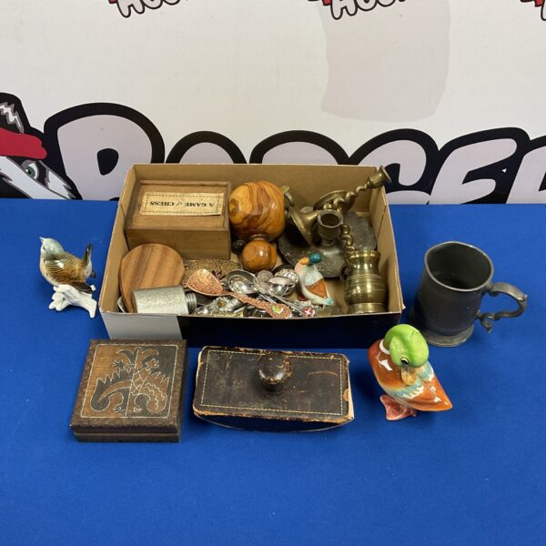 Vintage curios and collectibles lot with brass candlesticks and ducks.
