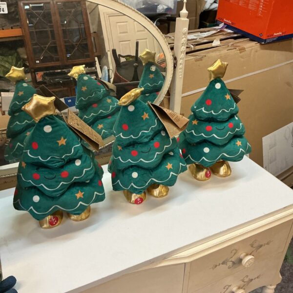 Lot of three animated dancing Christmas trees for festive holiday decor.