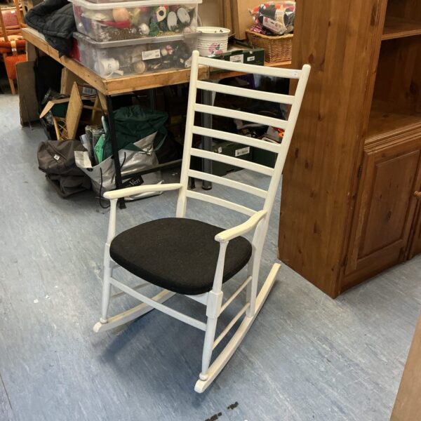 White painted Danish ladderback rocking chair with classic design.