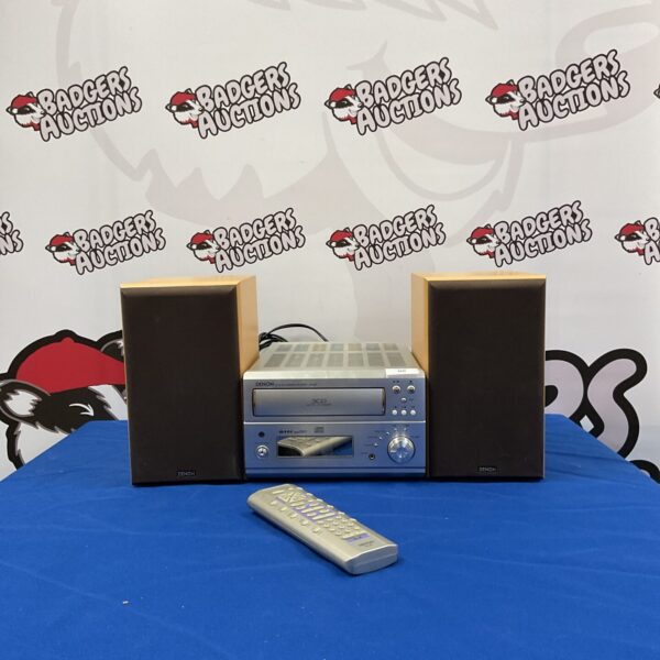 Silver Denon UD-M50 CD changer receiver with remote control.