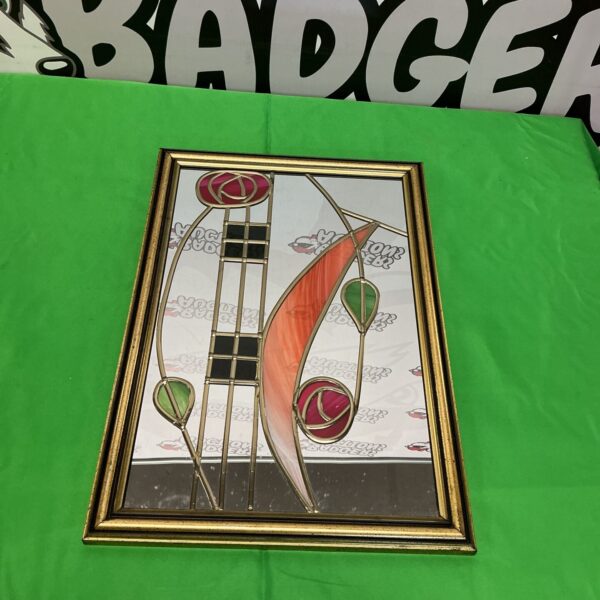 Gold geometric designer mirror, vintage mid-century style.