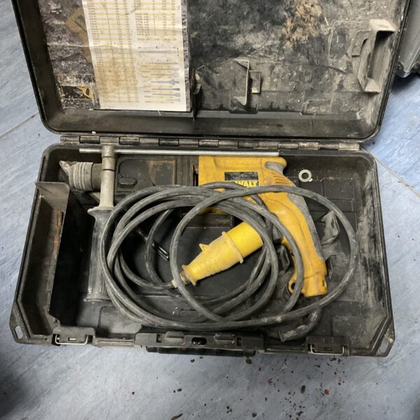 Used Dewalt SDS drill in open carrying case.