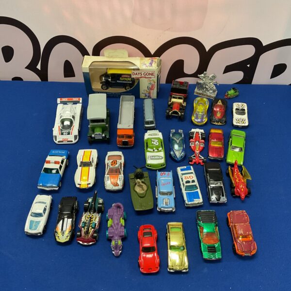 Vintage diecast vehicle lot including Hot Wheels and Matchbox cars.