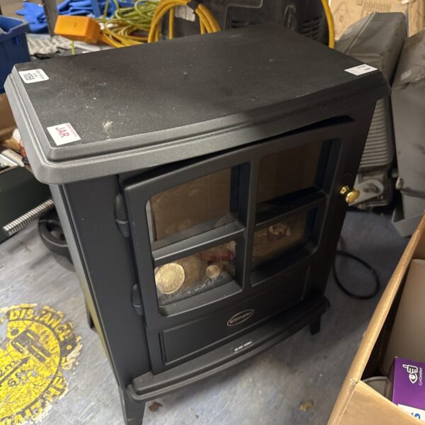 Vintage Dimplex electric fire with realistic flame effect.
