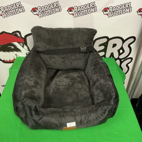 Padded dog car seat for small dogs, ideal for safe travel.