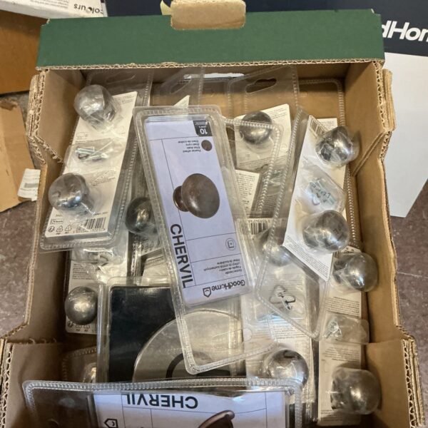 Box of assorted metal door knobs and handles.