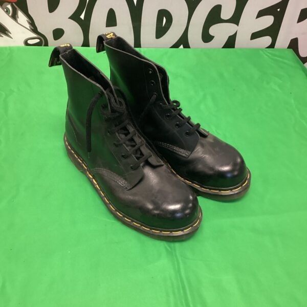 Black leather Dr Martens 1460 boots, classic and iconic footwear.