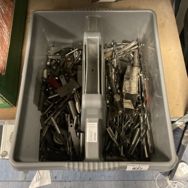 Tray of mixed drill and router bits for workshop use.