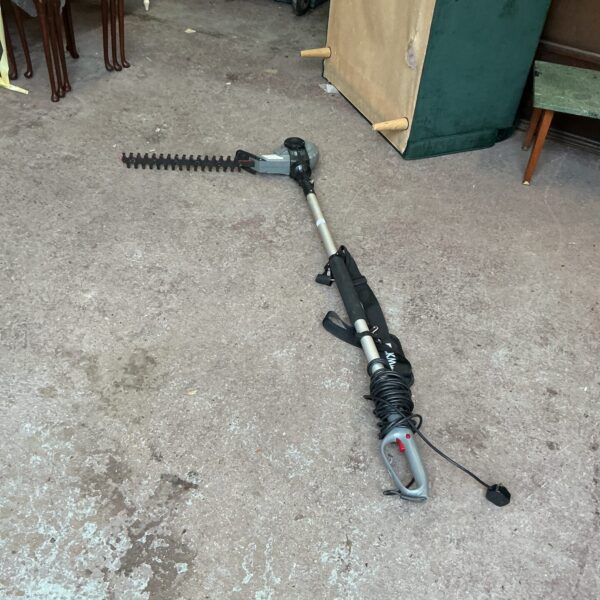 Vintage Eckman electric hedge cutter for garden maintenance.