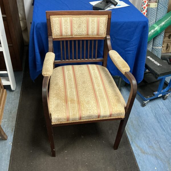 Antique Edwardian bedroom chair with patterned upholstery.