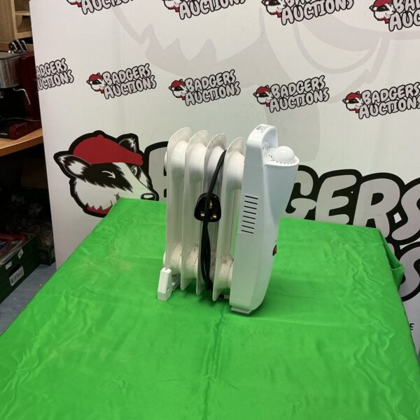 White electric panel heater for small spaces.