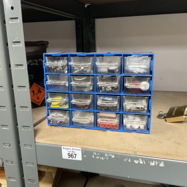 Blue plastic tray filled with assorted electrical components.
