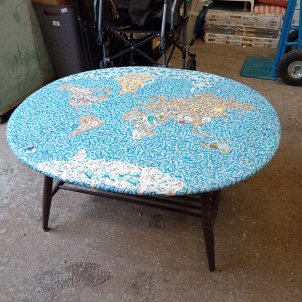Vintage Ercol coffee table with colourful decoupage tabletop.