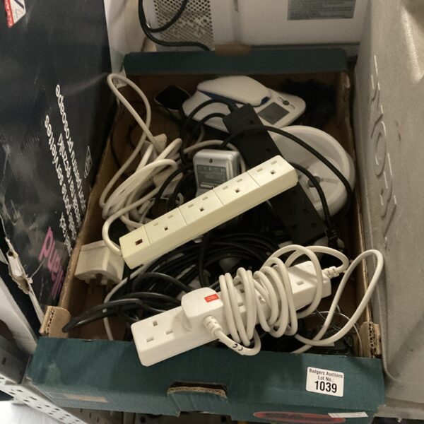 Selection of extension leads and power cables for household use.