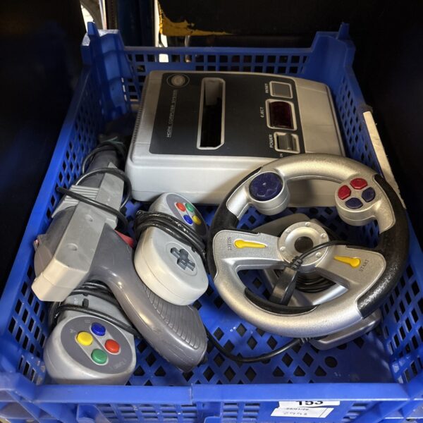 Grey Famiclone console with controller for retro gaming.
