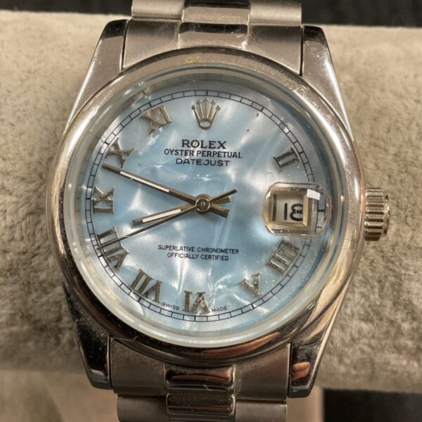 Stylish fashion quartz watch with a blue dial and silver-tone case.