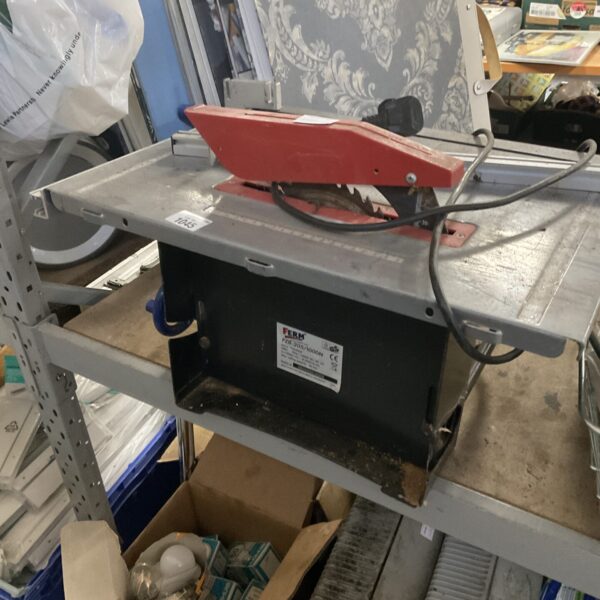 Vintage Ferm table saw for woodworking, showing wear and tear.