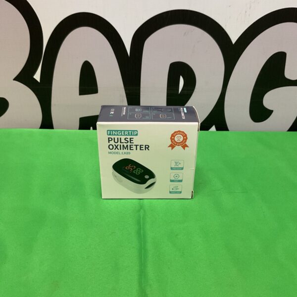 Close-up of a used fingertip pulse oximeter, model LK89.