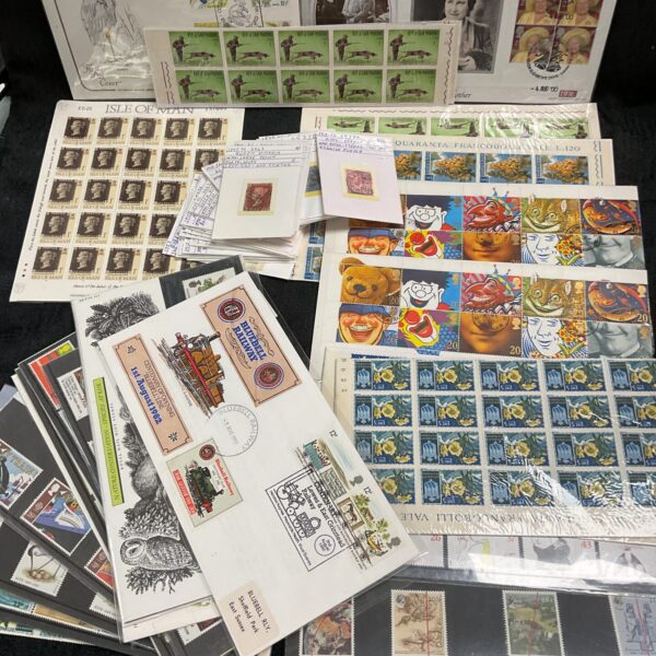 Assorted British first day covers and stamp sets for collectors.