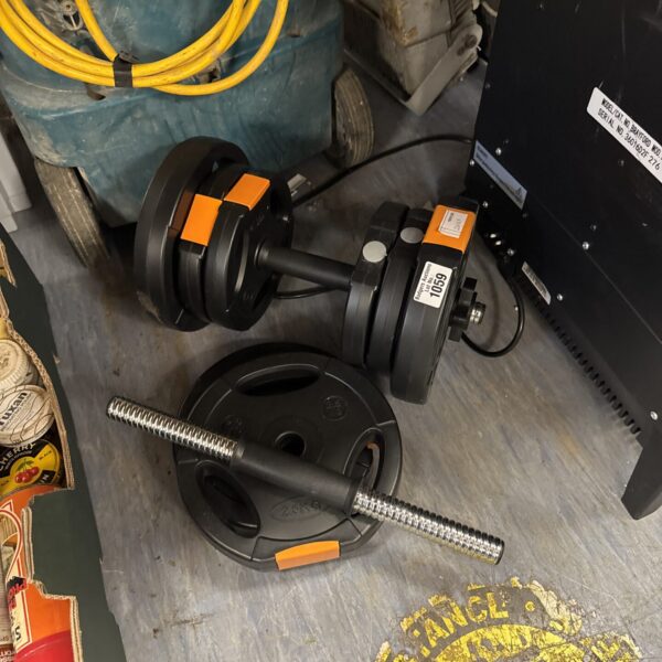 Black fitness dumbbells for weight training at home.