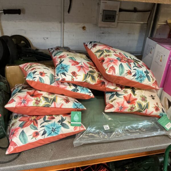 Vibrant floral garden furniture cushions for outdoor seating.