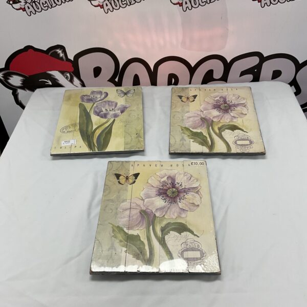 Set of three vintage floral wall art panels.