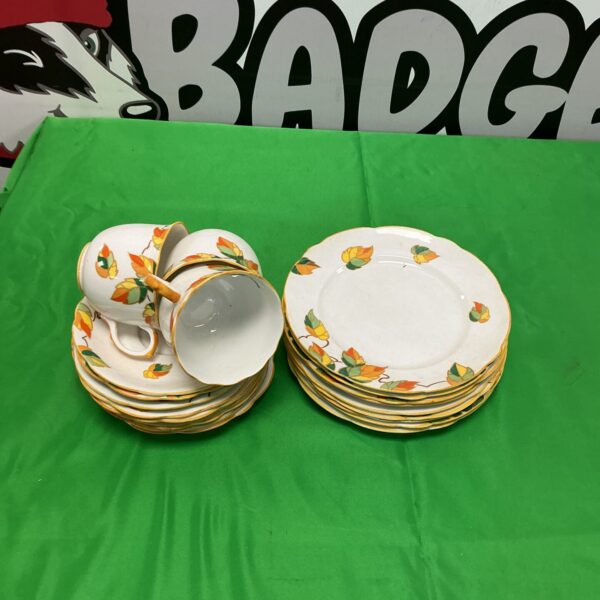 Vintage Foley China tea set with floral design on display.