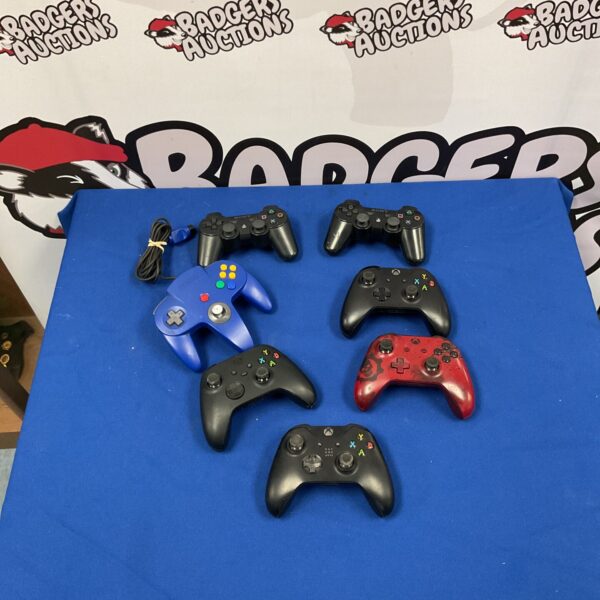 Mixed lot of gaming controllers including Playstation and Xbox.
