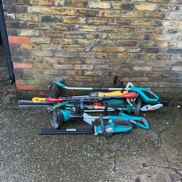 Electric garden power tool lot including a Bosch hedge trimmer.