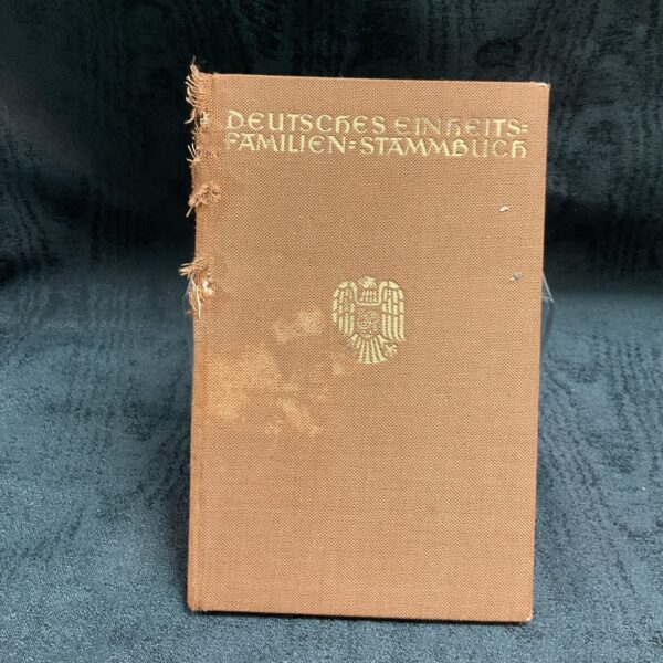 Vintage German family register cover with embossed details.