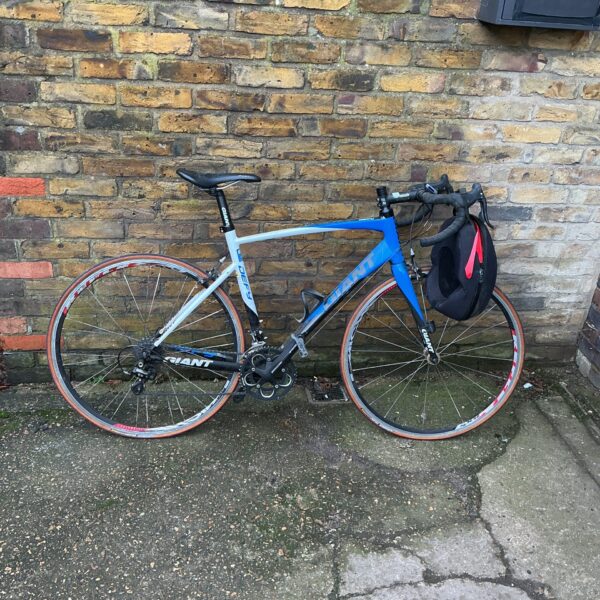 Blue and white Giant Defy road bike for sale.