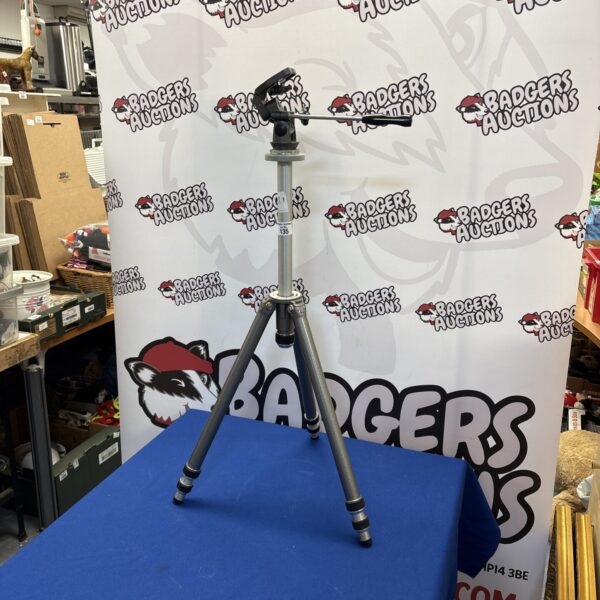 Vintage Gilux reporter camera tripod for photography.