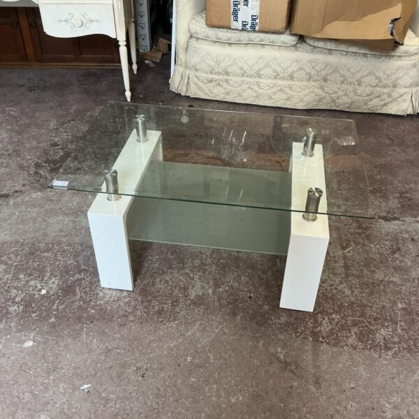 Vintage glass top coffee table with chrome frame.