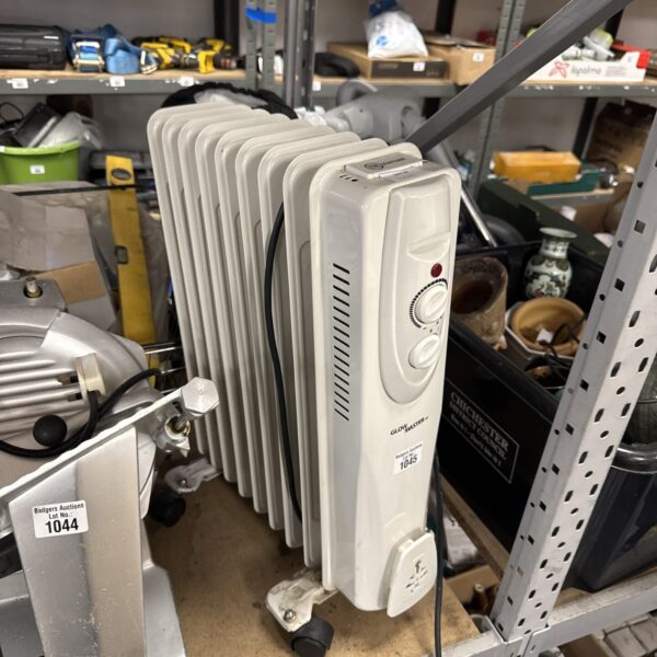 White Glowmaster oil filled electric heater with dial control.