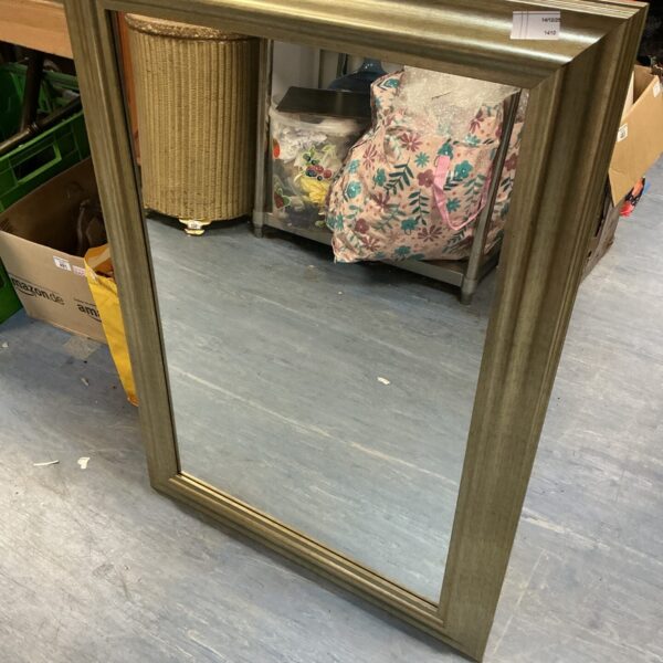 Vintage gold gilt mirror with ornate frame.
