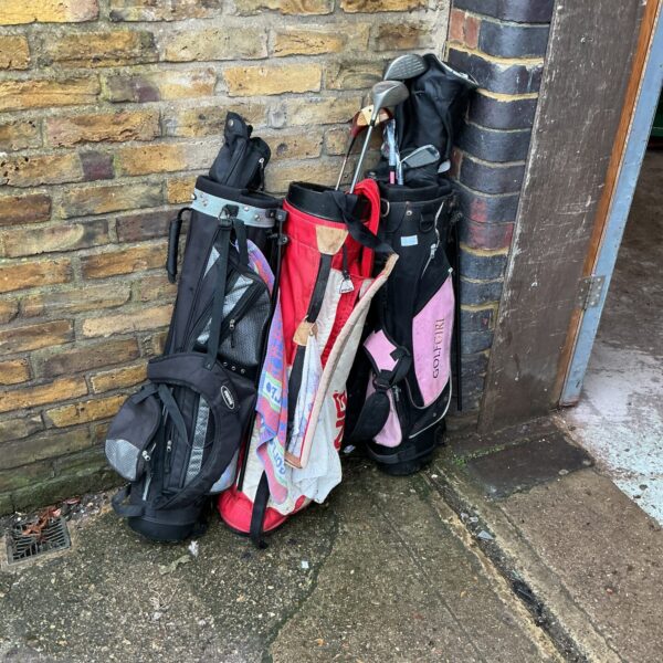 Lot of three vintage golf bags, including a Ping model.