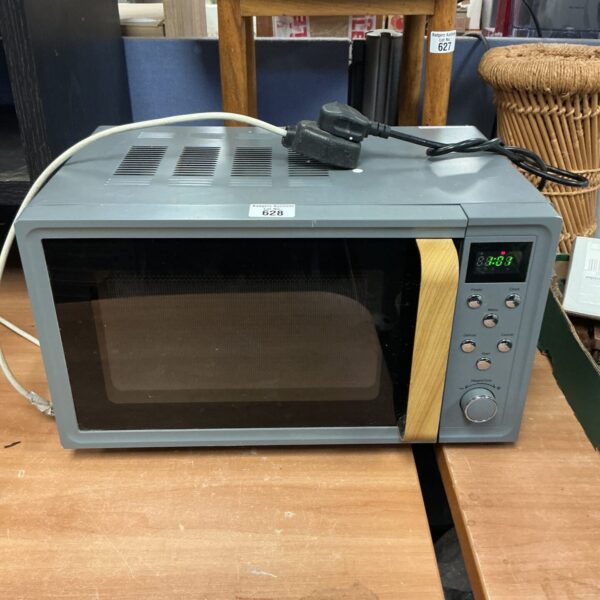 Front view of a grey microwave oven, kitchen appliance.