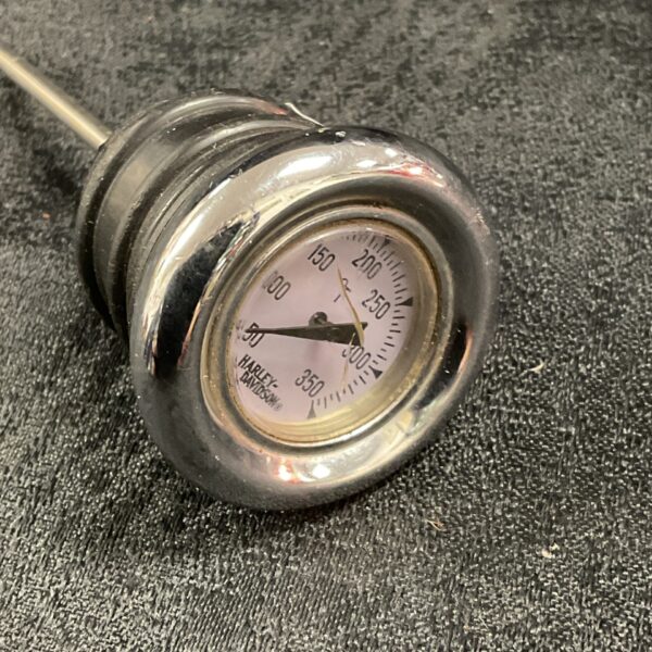 Vintage Harley Davidson temperature gauge for classic motorcycles.