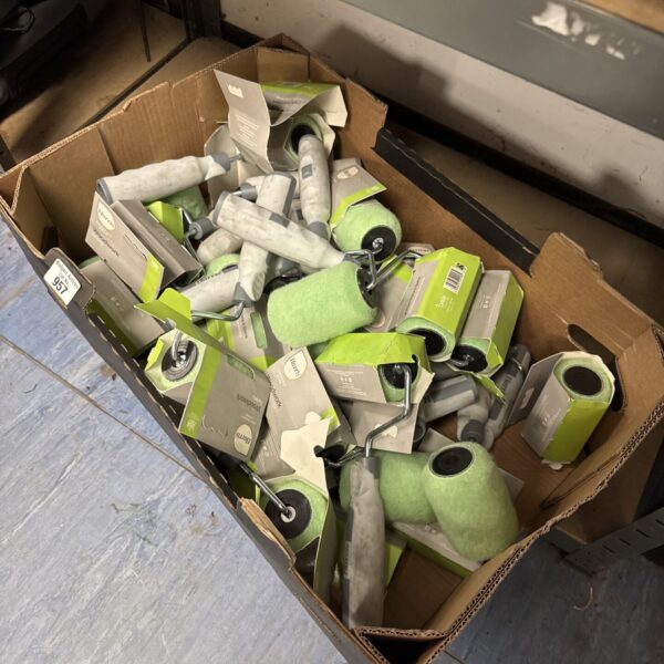 Tray of new Harris 4 inch paint rollers for DIY projects.