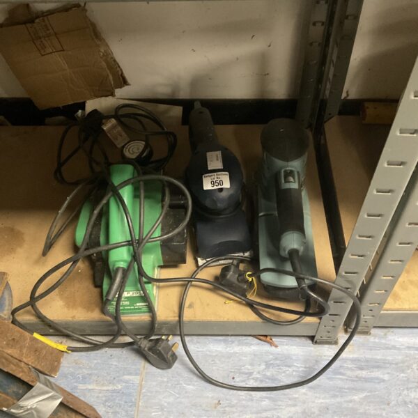 Close-up of a Hitachi belt sander in a tool lot.