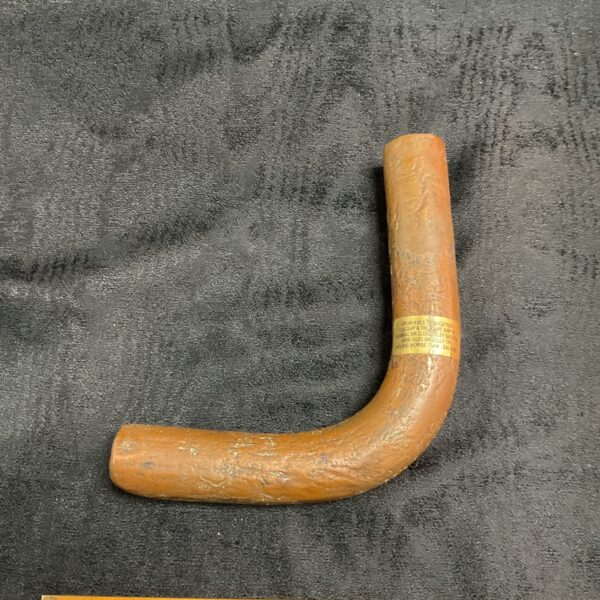 HMS Association shipwreck salvage, weathered copper pipe fragment.