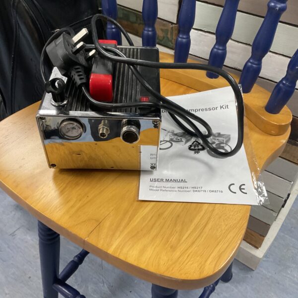 Small hobby air compressor kit for airbrushing and model making.