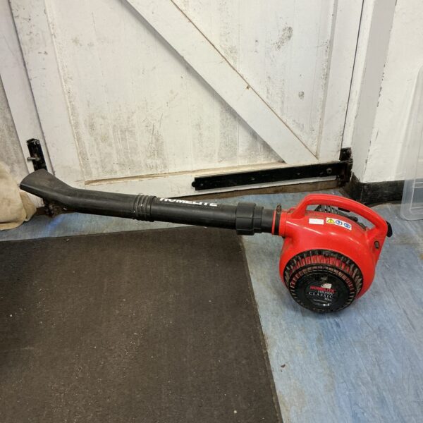 Vintage Homelite HB390V petrol leaf blower for garden clearing.