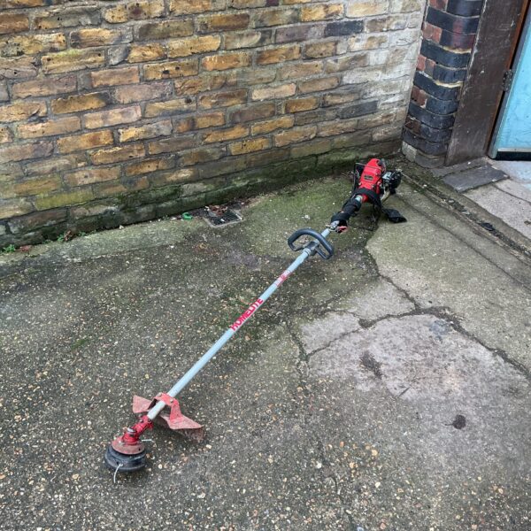 Homelite petrol garden strimmer for garden maintenance.