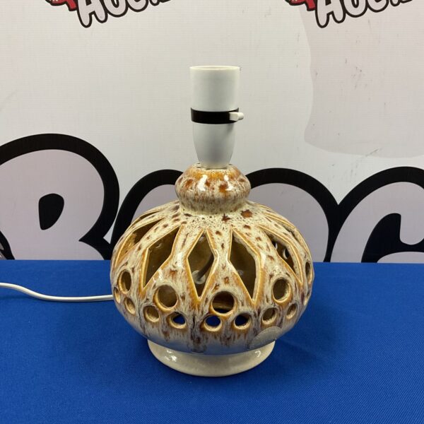 Vintage honeycomb pottery table lamp with a unique design.