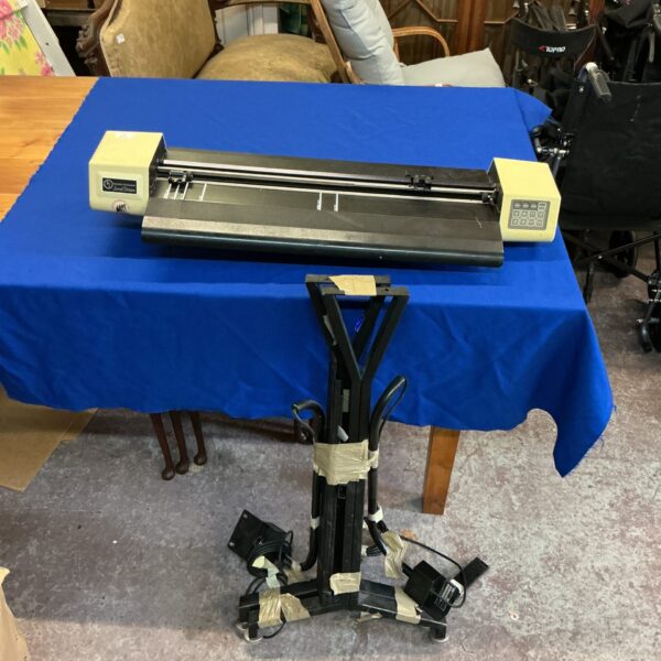 Vintage Houston Instruments digital plotter with stand, side view.